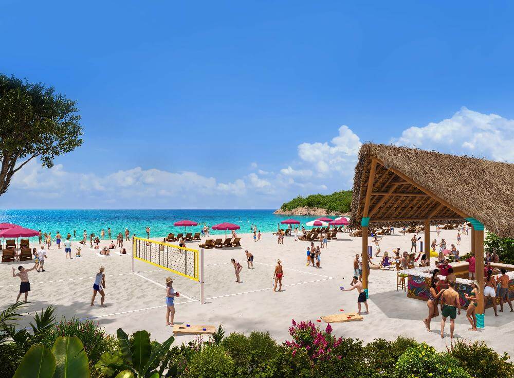 Royal Beach Club Lelepa white sand beach with volleyball court pink umbrellas and crystal clear water Vanuatu