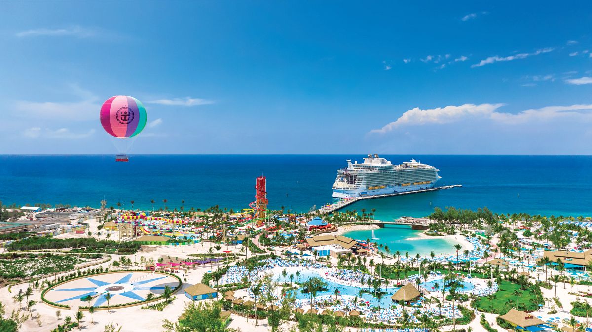 Perfect Day at CocoCay aerial view Royal Caribbean private island Bahamas with cruise ship and hot air balloon