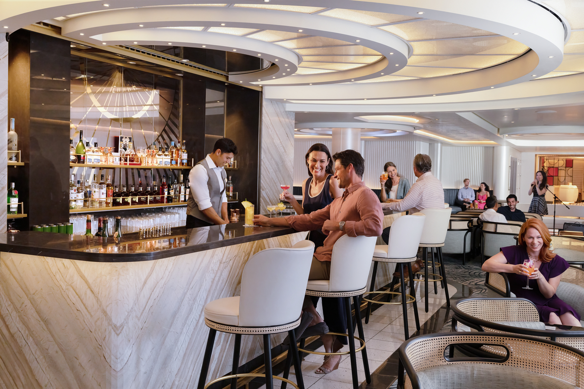 Norwegian Prima bars — guests enjoying cocktails at Metropolitan Bar