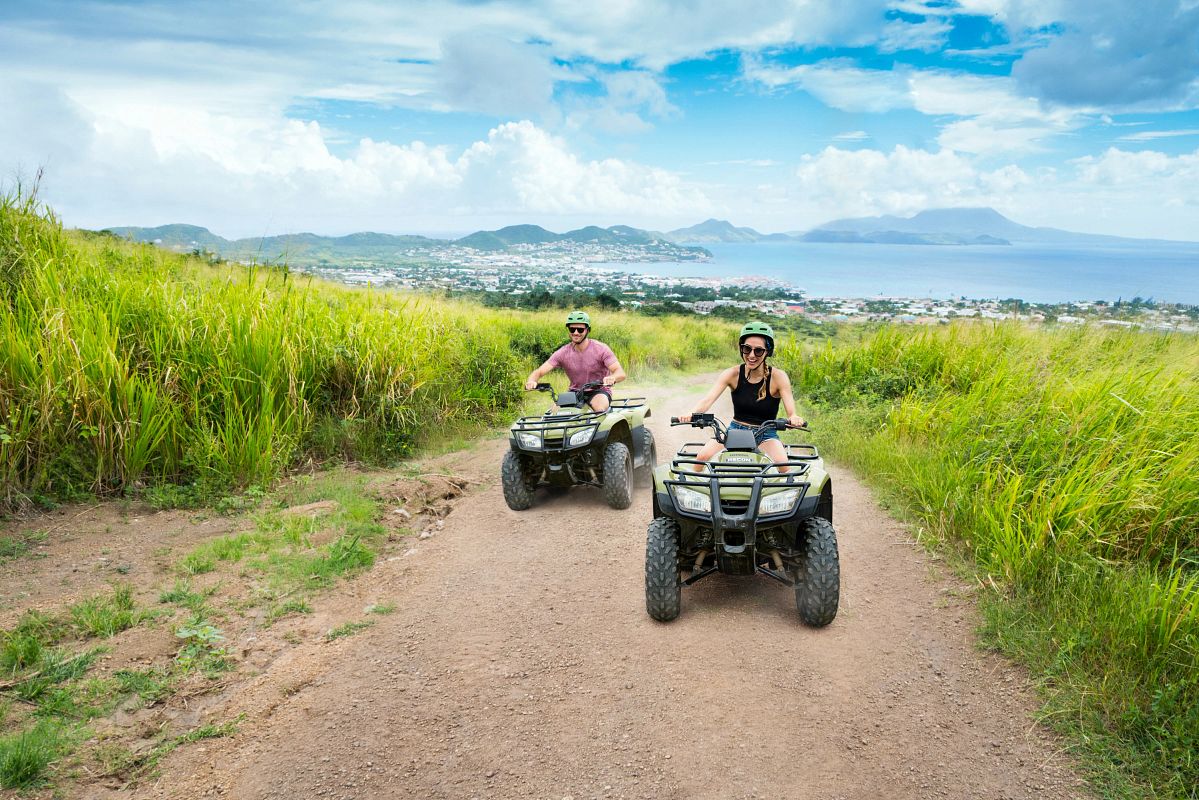 ATV excursion safety on cruises - Royal Caribbean shore excursion guests riding ATVs on a dirt trail in St. Kitts