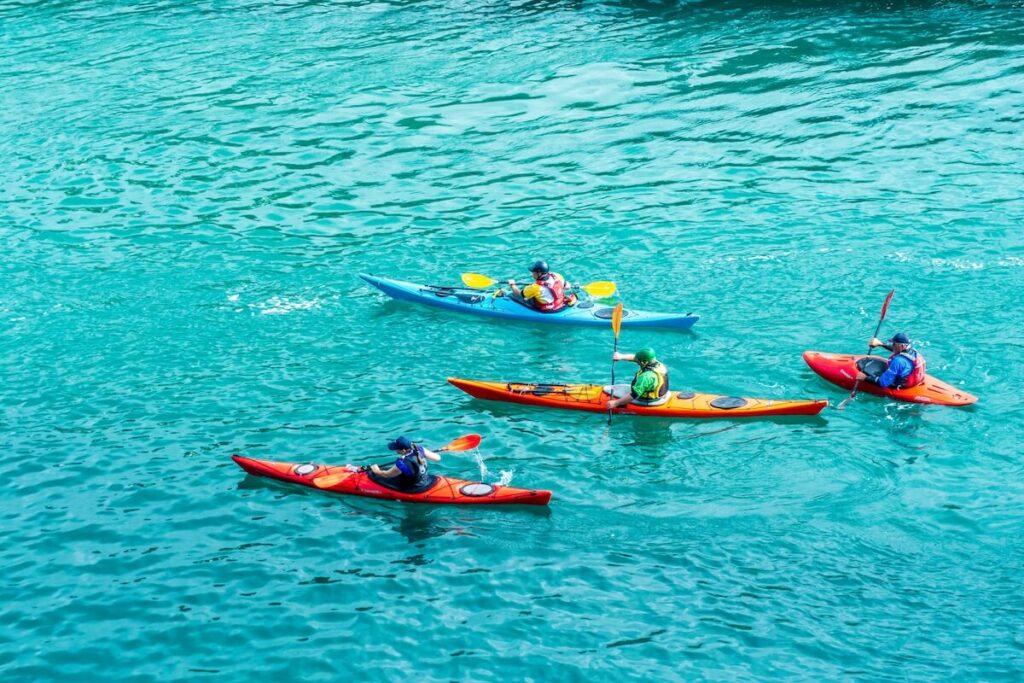 Group kayaking together on a tropical shore excursion