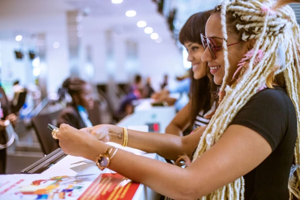 Travelers checking in before boarding — documents and ID ready