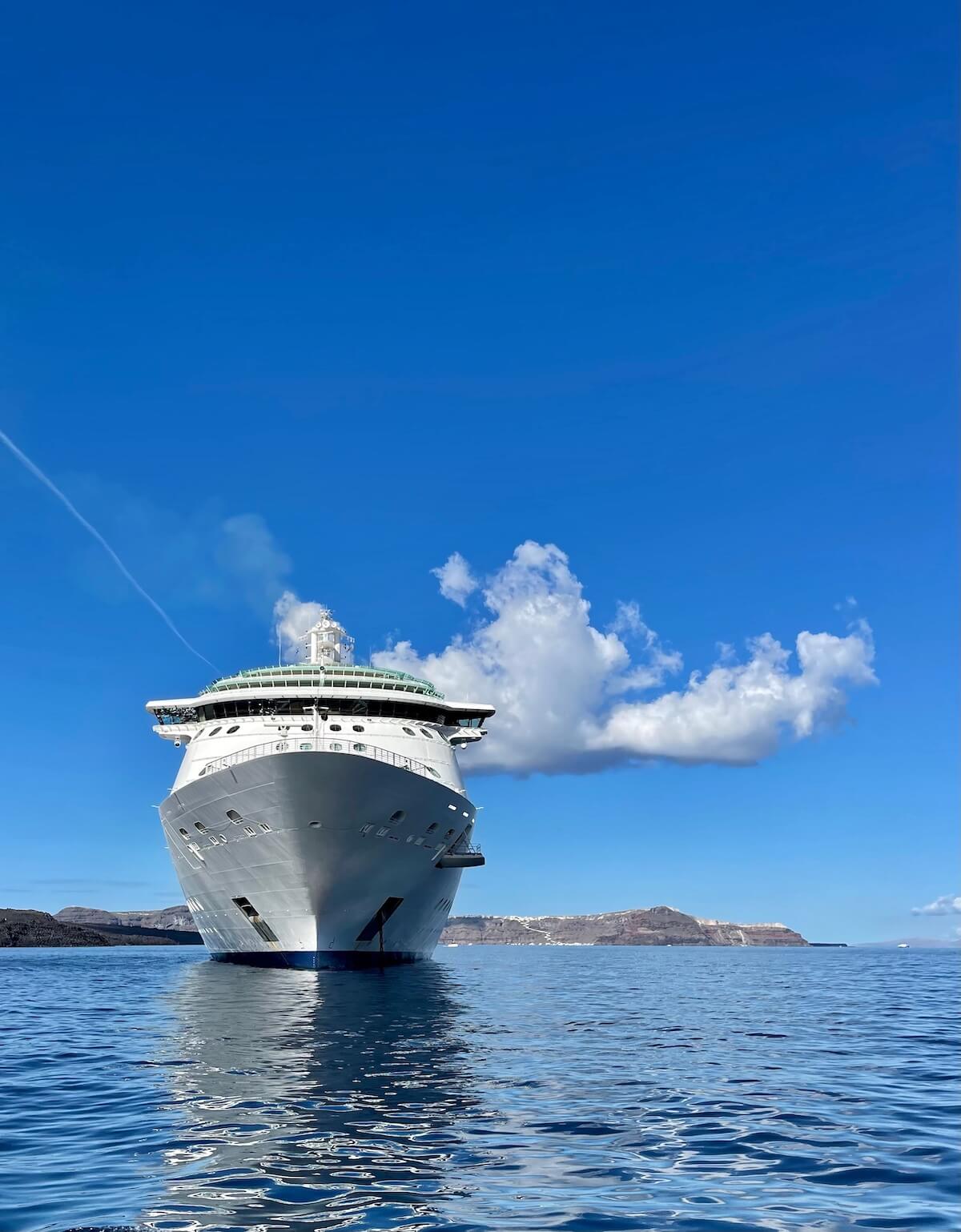 Service dogs on cruises — cruise ship anchored off Santorini