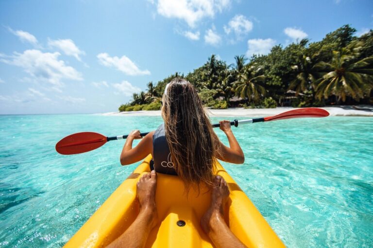 Kayaker paddling on an independent excursion covered by shore excursion insurance