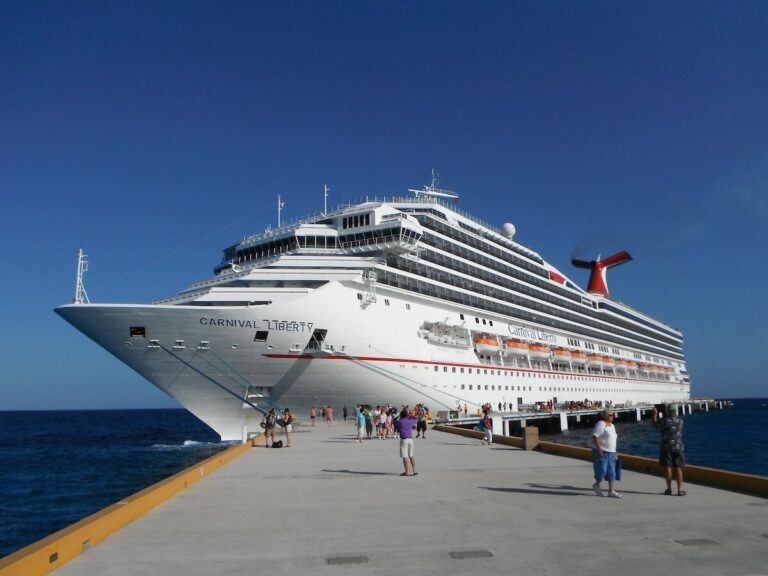 Cruise ship docked at port, illustrating shore excursion safety planning for independent travelers