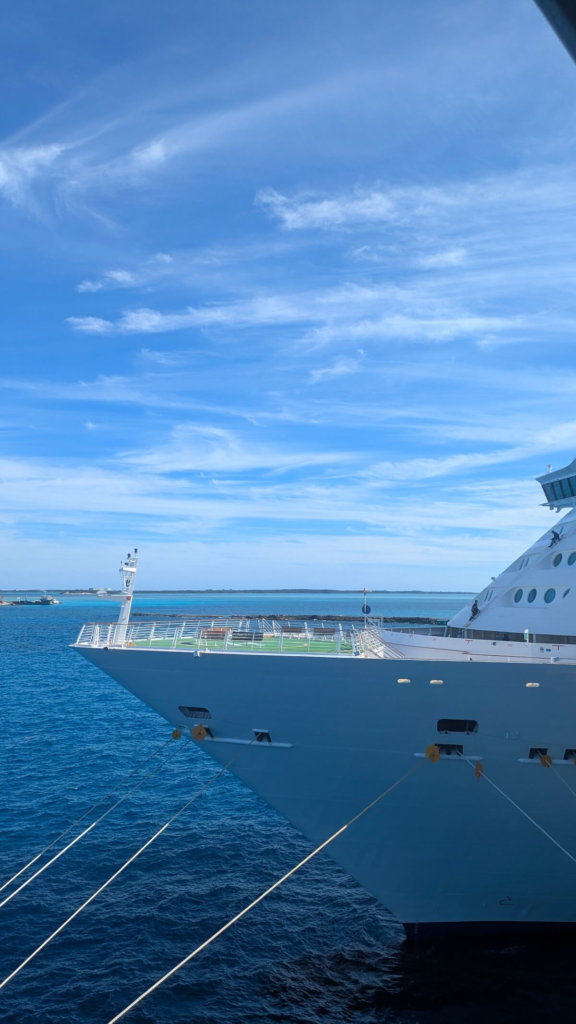 Cruise ship sailing under a clear blue sky
