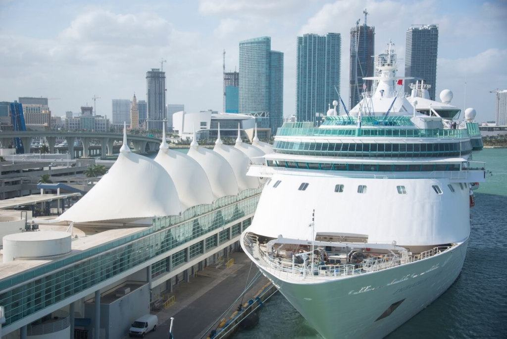 Cruise ship moored in Miami harbor with city skyline