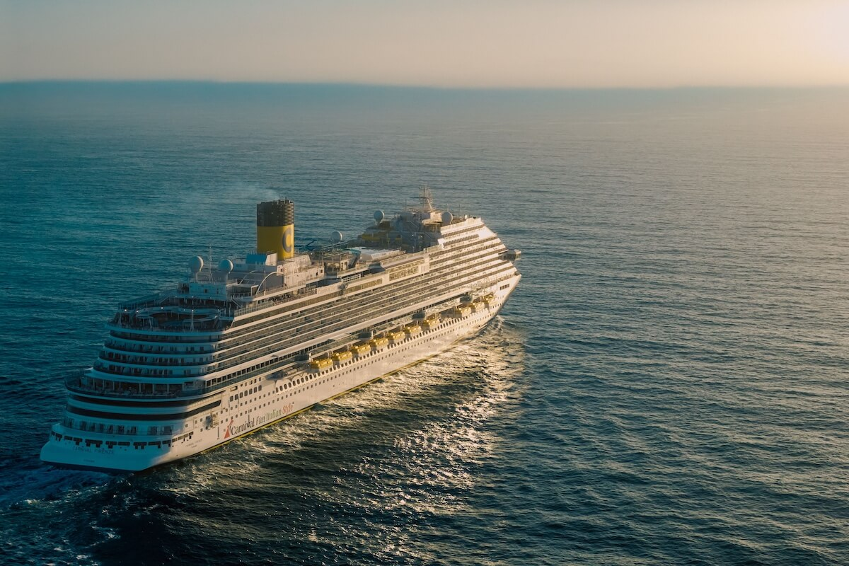 Cruise ship sailing the open ocean at sunset, 90 day cruise checklist