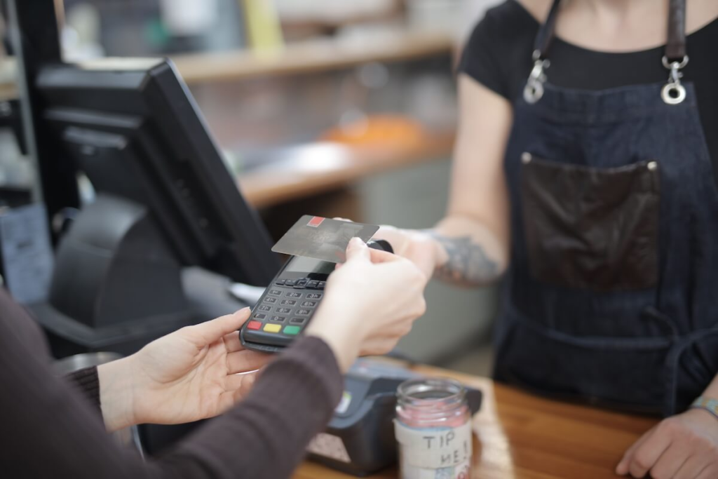 Credit card being handed to a vendor during an in-port purchase