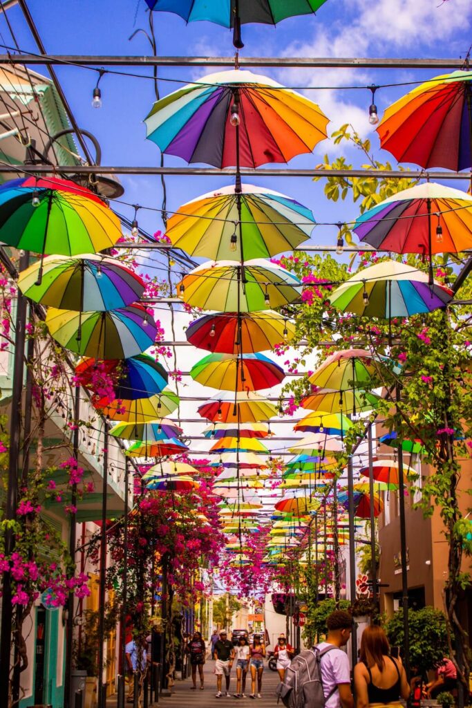 Colorful umbrellas hanging over a pedestrian street in downtown Puerto Plata, Dominican Republic
